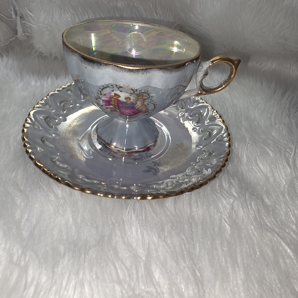 Elegant Gold and Silver Teacup and Saucer Set